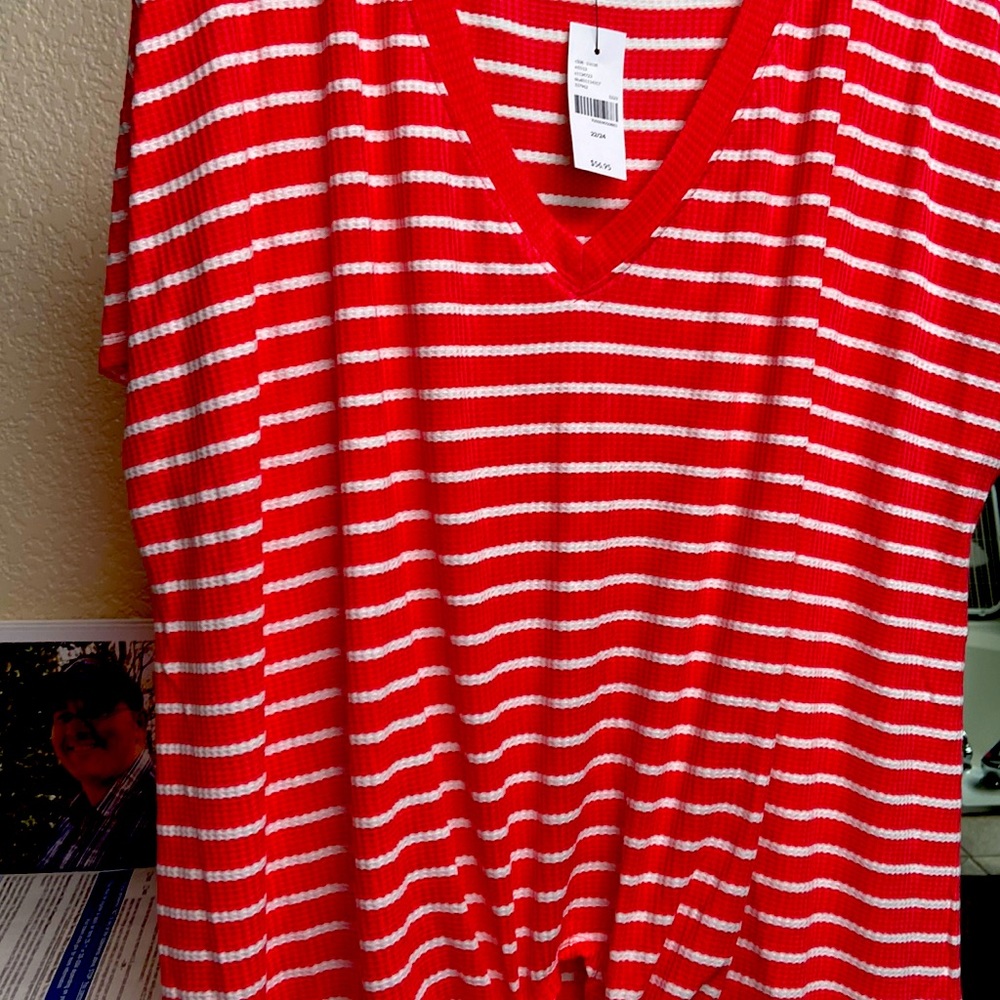 A red and white striped shirt brand new never been worn